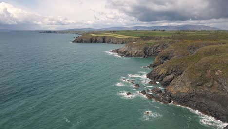 drone shot of a long coast line in waterford, ireland