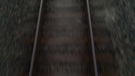 drone shot tilting up from railroad tracks to late evening sky in texas, u