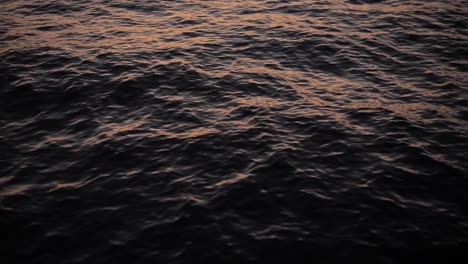 dusk light reflecting on the water surface of the sea lake