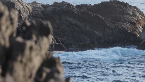 Violent-ocean-waves-crash-on-coastal-rocks-and-cliffs