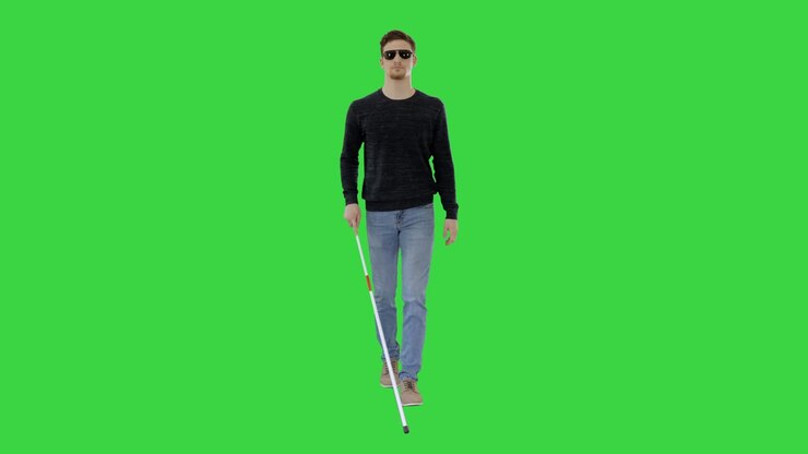 Giovane cieco con bastone che cammina su Green Screen, Chroma Key