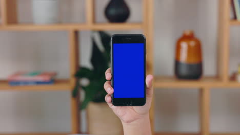 Person,-hands-and-blue-mockup-phone-screen