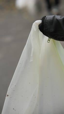 person wearing safety vest and cleaning