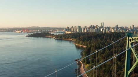 aerial drone reveal of the lions gate bridge passing very close - british colombia