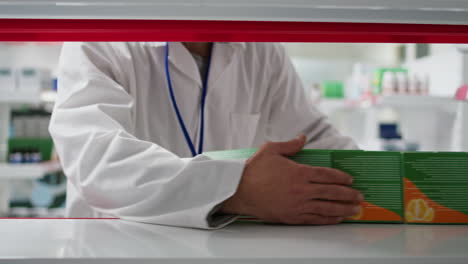 pharmacy worker emptying shelves for stock reorganization