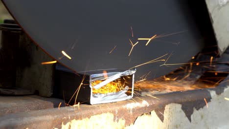 worker cutting a rectangular pipe steel with circular saw machine