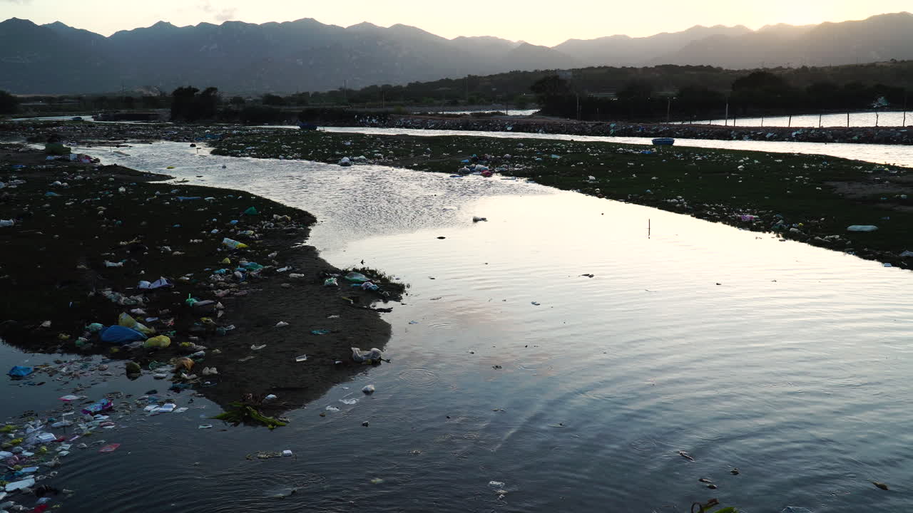 Majestic Vietnam landscape and garbage filled river banks, static view