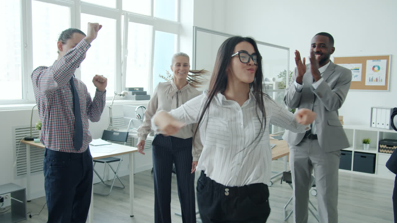 Happy Business Team Dancing in Office