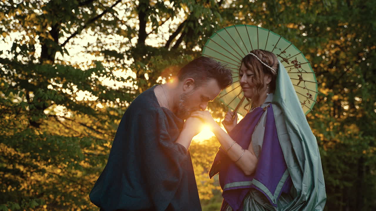 Couple in Historical Costumes at Sunset