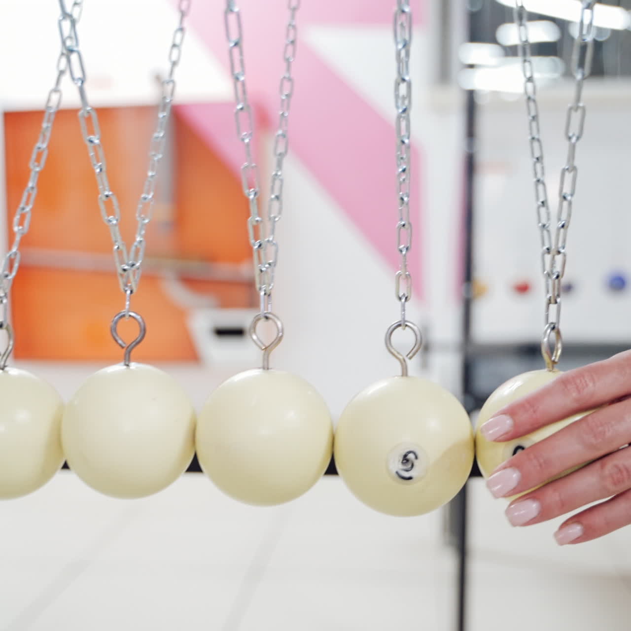 Newton's cradle showing laws of physics in motion. Museum of Science