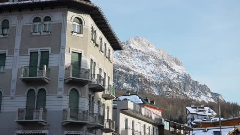 building with a frozen mountain in the background