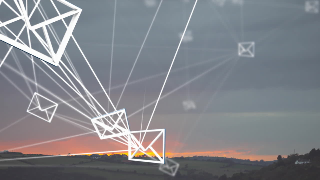 Geometric shapes and lines animating over scenic sunset landscape in background
