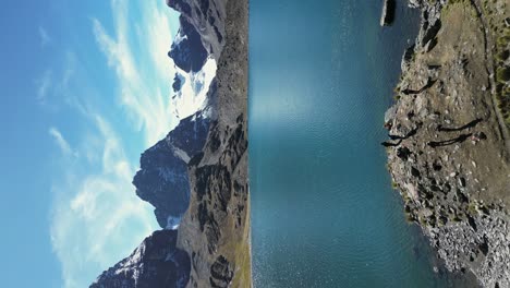 Tourists enjoy view of Laguna Zongo in Andes mountains of Bolivia