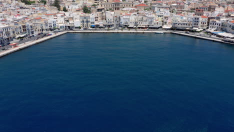 Aerial:-Slow-reveal-shot-of-picturesque-Emoupoli-town-of-Syros-island-,Cyclades,-Greece