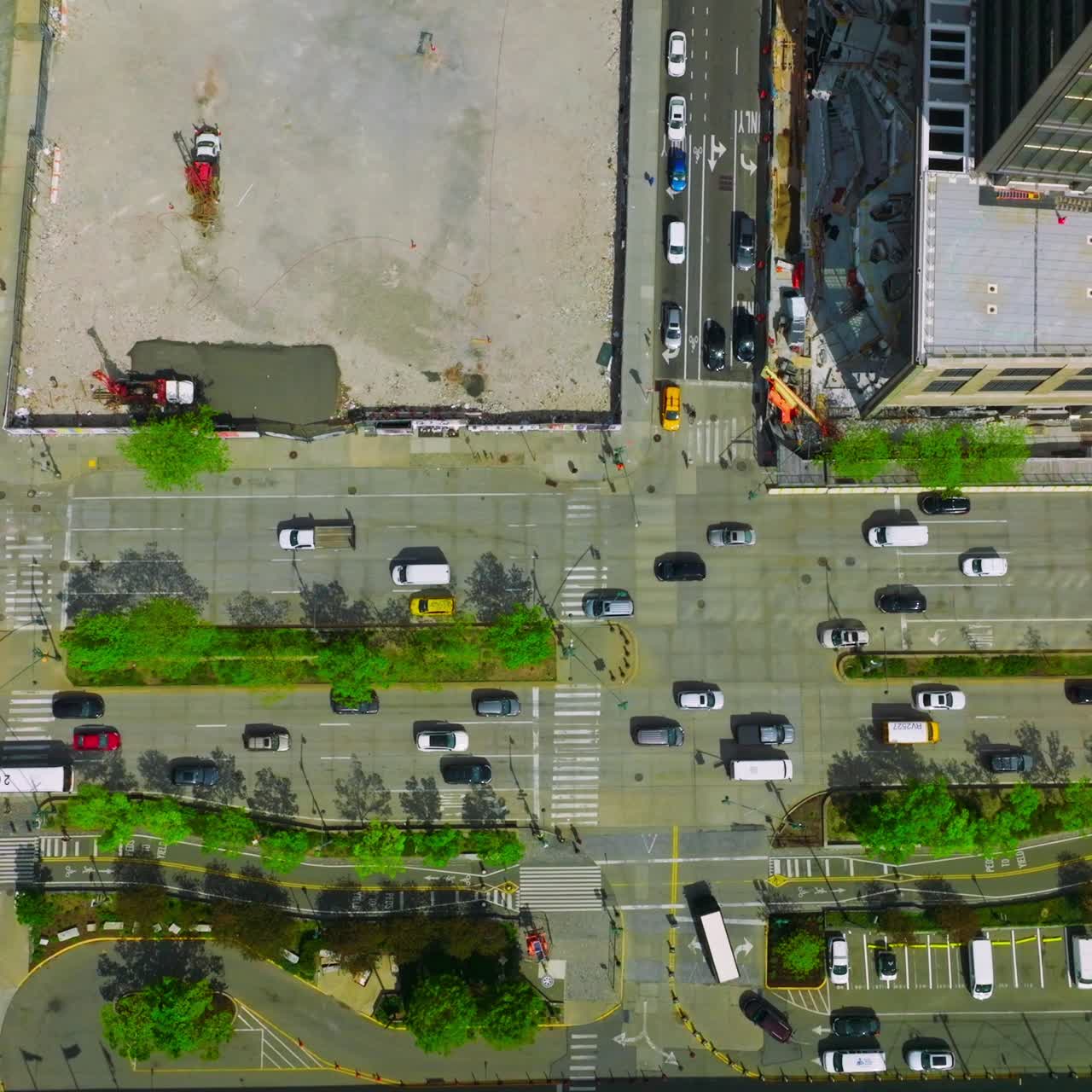 Heavy traffic on the motorways of New York. Vibrant city movement at daytime. Bird's eye view