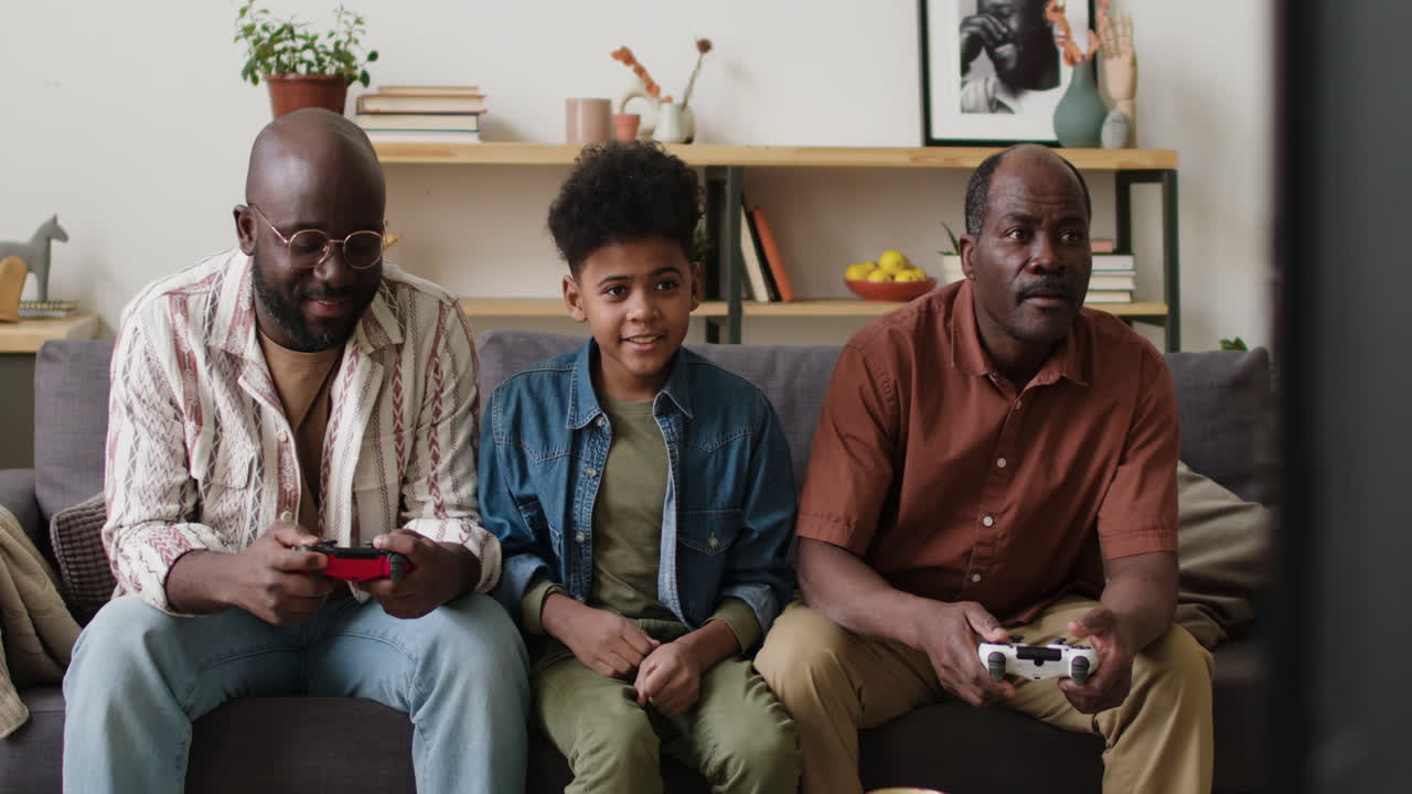 Men and boy playing video games