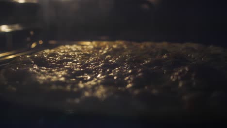 pizza baking in an oven