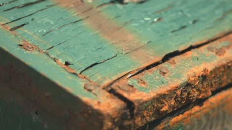 Close-up-of-a-green-metal-box-with-red-and-orange-rust