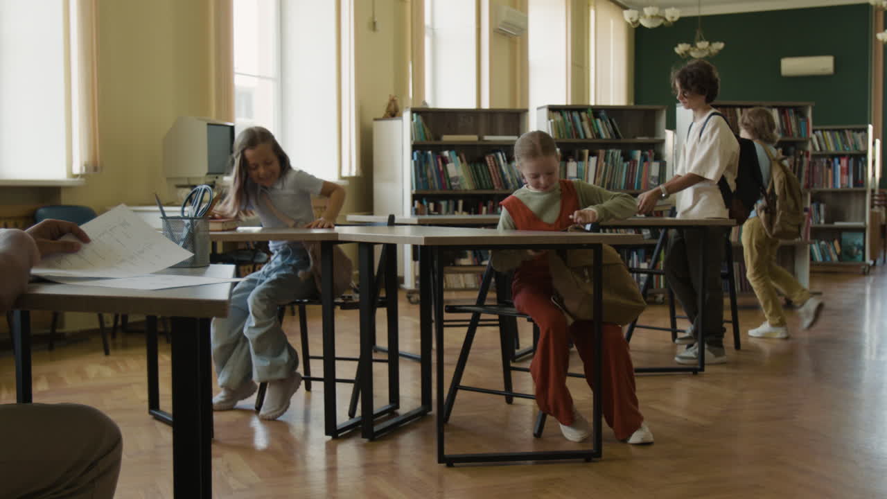 Children Preparing for Class in a School Library or Classroom