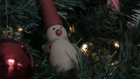 detail wooden snow toy, ball and tree decoration and lighting of christmas tree