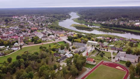 curvy river and beautiful township of kraslava, aerial drone view