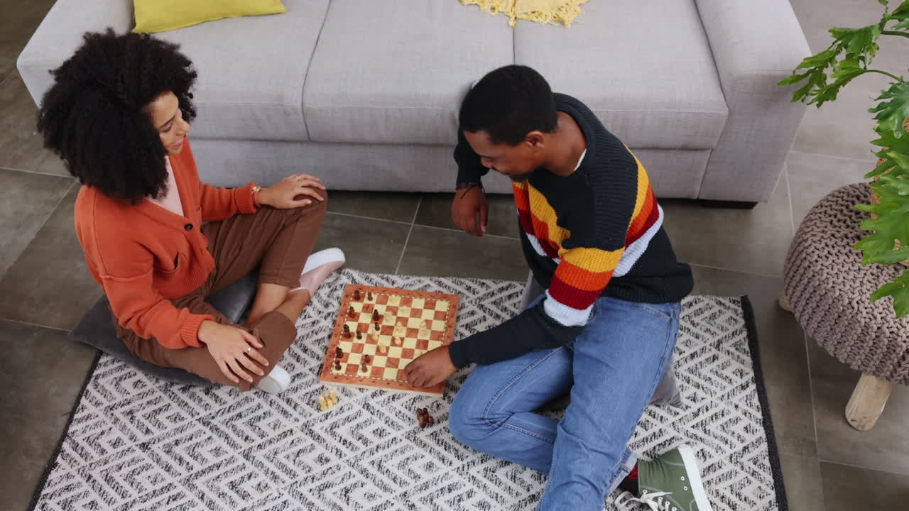 Chess, game and couple on floor in home playing