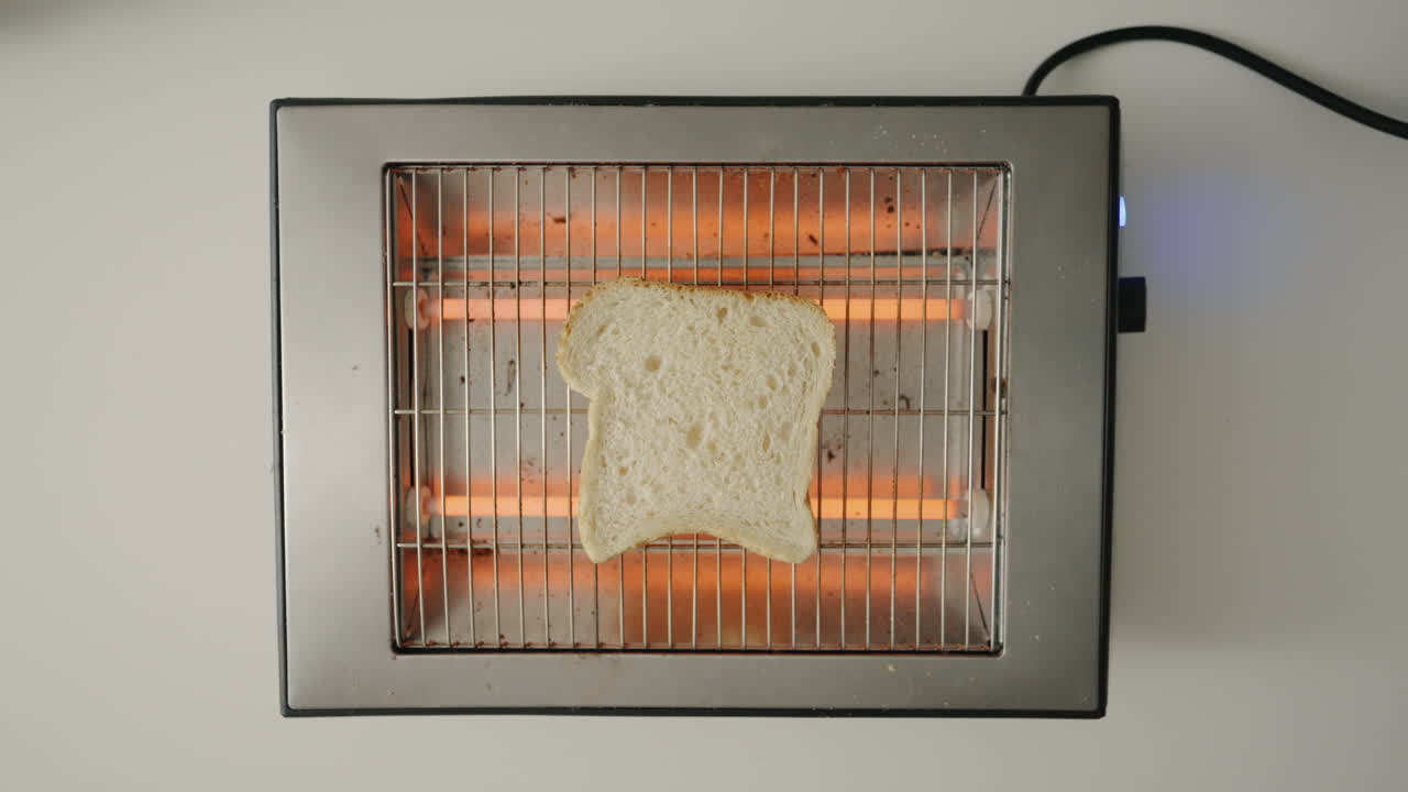 Dropping toast on retro toaster toasting a toast top shot 4K