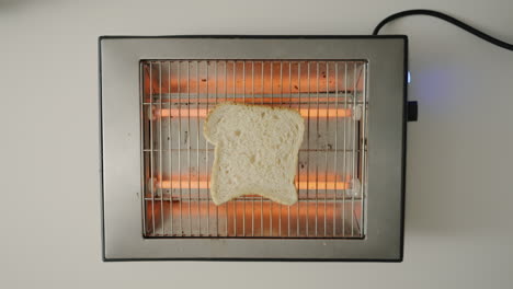 dropping toast on retro toaster toasting a toast top shot 4k