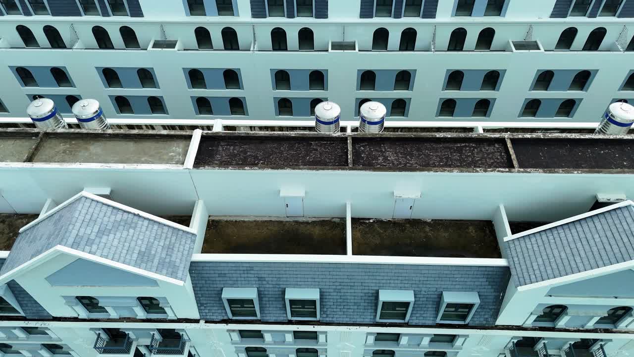 Aerial: Grand World fake Venice town buildings during the day in Phu Quoc Island, Vietnam, pan drone shot