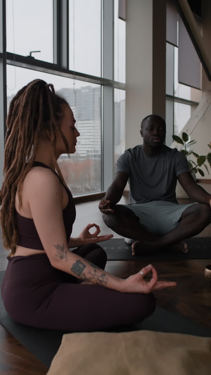 Couple Meditating in a Modern Yoga Studio