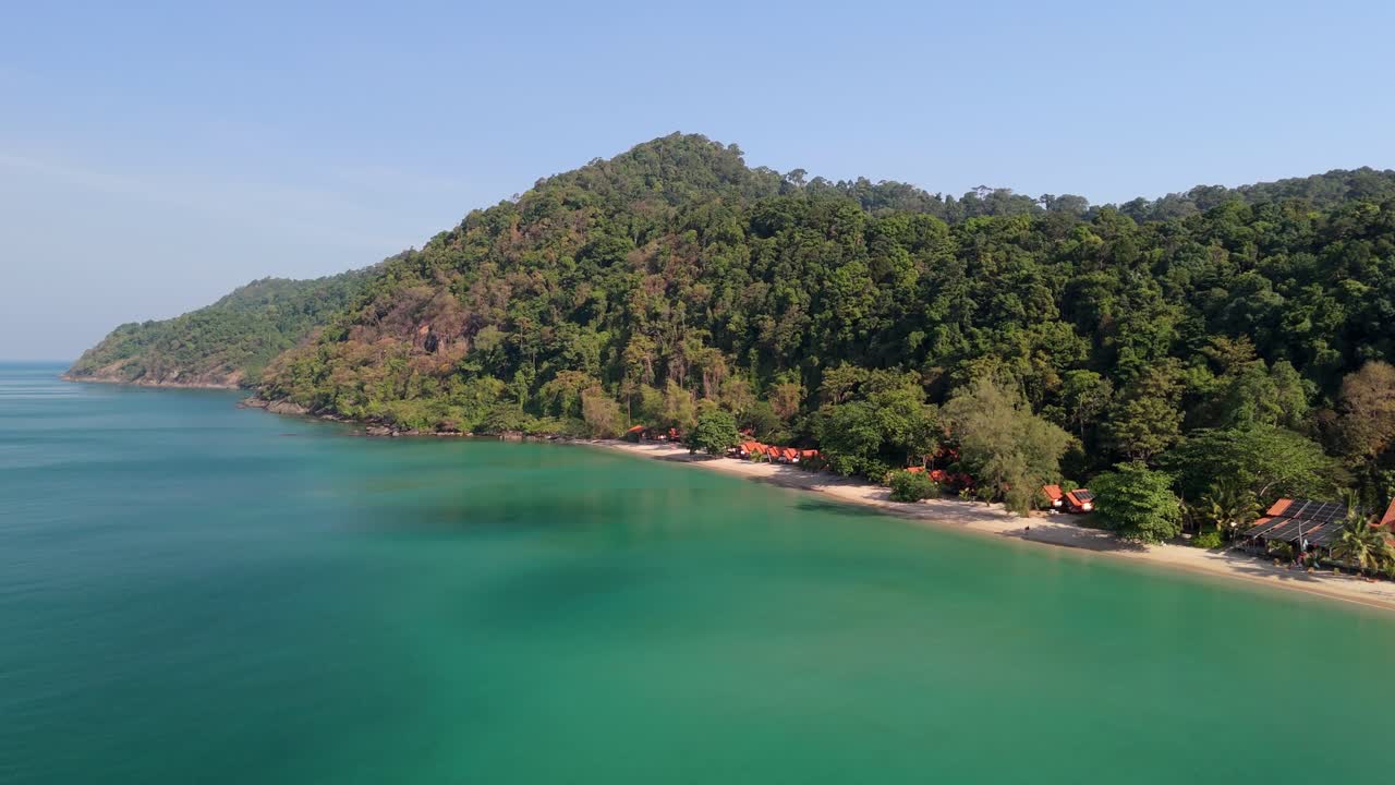 Aerial drone footage of White Sand Beach village, Koh Chang, Thailand. Capturing sunny morning views of the coast and tropical scenery