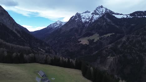 aerial view of drone fly above austrian alps surrounded by mountain landscape at bazora, vorarlberg, austria