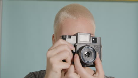 female photographer poses with vintage camera 05