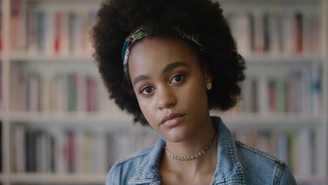 portrait-beautiful-young-african-american-woman-student-looking-pensive-contemplative-black-teenage-girl-in-library-bookstore-with-afro-hairstyle-slow-motion