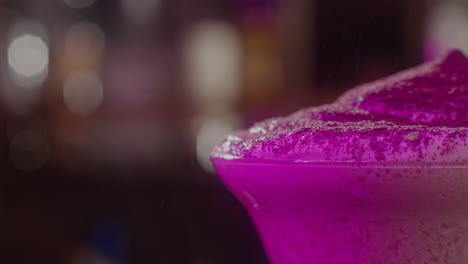 purple cocktail with foam