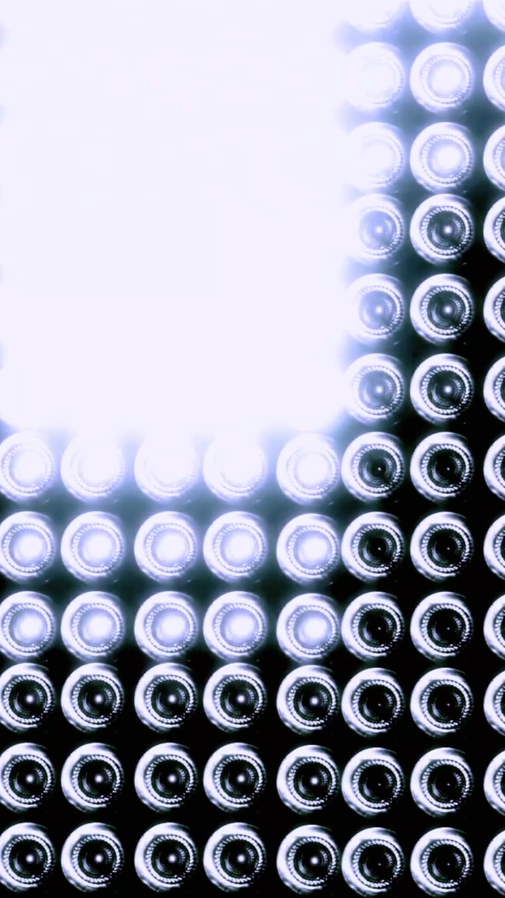Dynamic Lighting Pattern on a Grid of Glass Bottles