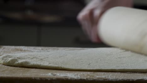 rolling out dough with a rolling pin