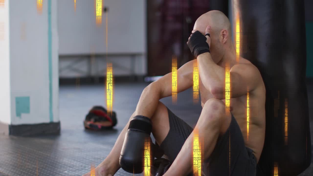 Male boxer sitting by punching bag, adjusting gloves after sparring, golden streaks crossing frame