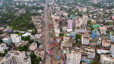 City-Road-With-Traffic-Through-Barisal,-Bangladesh---Aerial-Drone-Shot