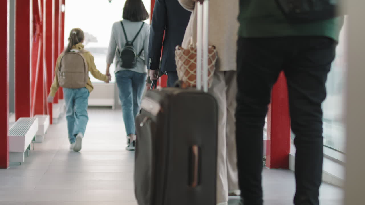 Passengers Boarding On Airplane