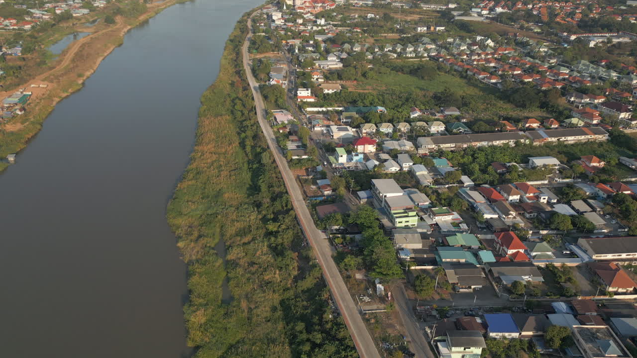 Lush Green Banks Of The Ping River Nakhon Sawan Thailand At Sunset 4K 60FPS