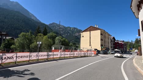 car driving through picturesque mountain town