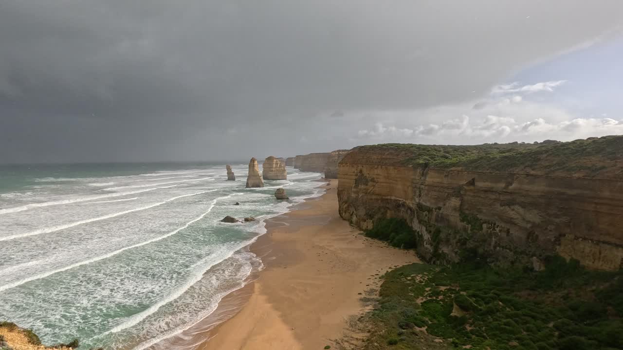 Scenic cliffs and ocean waves at sunset