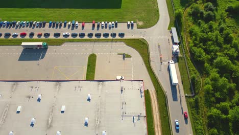 Aerial-view-of-warehouse-storages-or-industrial-factory-or-logistics-center-from-above