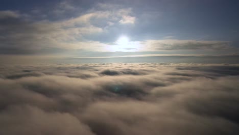 calm and relaxing aerial view above clouds during sunrise