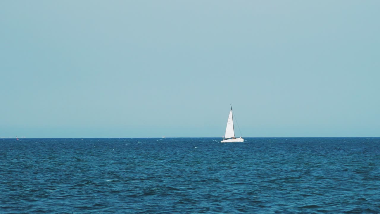 Sea with a sailboat on the horizon. Sea horizon.