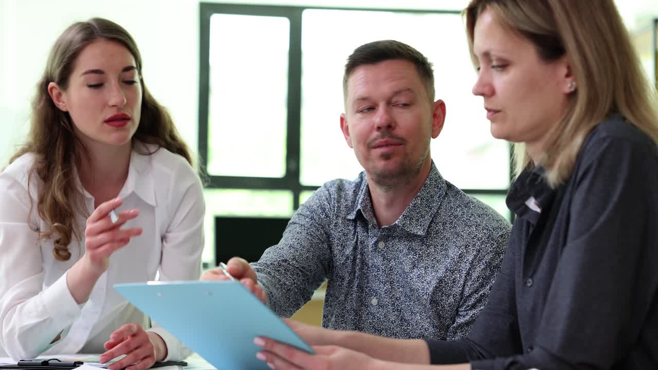 Business Professionals Collaborating and Discussing in an Office Meeting