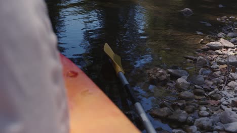 kayak and paddle by the river