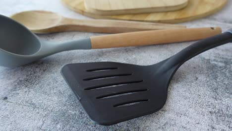 kitchen utensils: spatula, ladle and wooden spoon