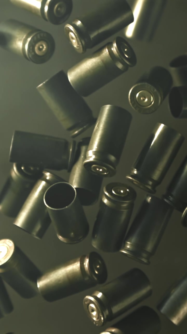 Empty Bullet Casings Falling in Slow Motion